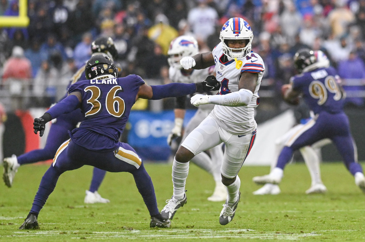 Safety Chuck Clark reaches for Bills' WR Stefon Diggs during a 2022 game